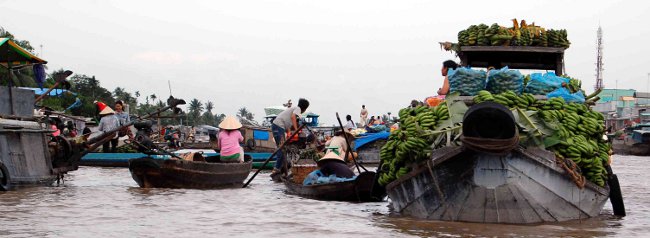 Floating river market on the Mekong in Vietnam Floating river market on the Mekong in Vietnam